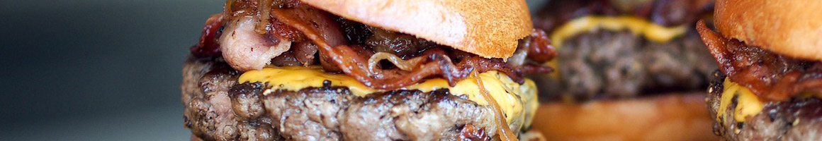 Eating American (Traditional) Burger at Burgers & Beer restaurant in Temecula, CA.